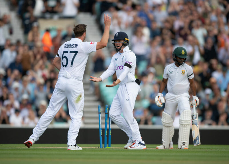 Ollie Robinson of England celebrates with Ollie Pope after taking the wicket of Keegan Petersen during Day Three of the Third LV= Insurance Test Match between England and South Africa at The Kia Oval on September 10, 2022 in London, England.